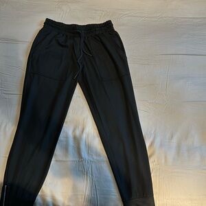 Six/fifty joggers. Dressed up with metallic finish and high quality zippers.